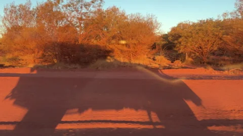 Vehicle on red dirt road through outback at Karijini Pilbara Stock Footage 319298632
