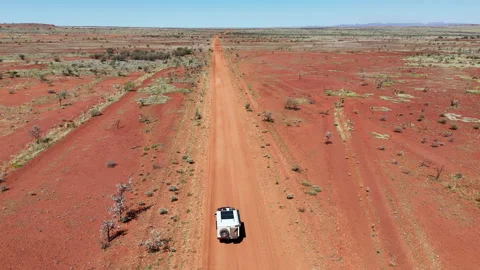 Vehicle on red dirt road through outback at Karijini Pilbara Stock Footage 319300802