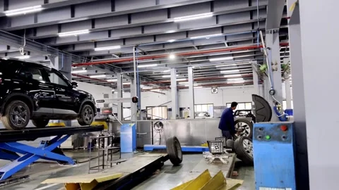Vehicle Service in Well Equipped Workshop with Professional Car Washing Stockbeeldmateriaal 336177796