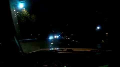 In vehicle shot driving down dark street at night Vídeo Stock 251283073