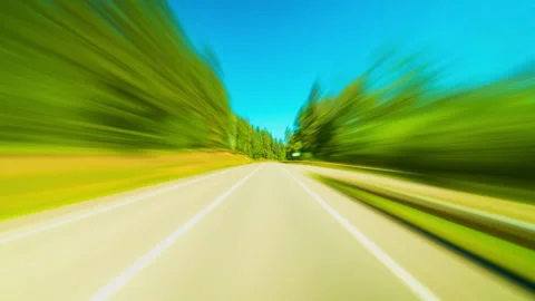 A Vehicle Swiftly Navigating a County Road Through a Picturesque Autumn Forest. Stock Footage 294525641