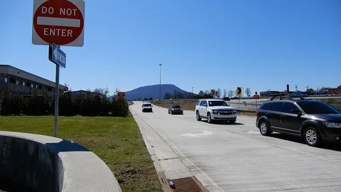 Vehicle Traffic Exiting Highway Freeway During Day Bright Blue Sky Near Do N Stock Footage 129571464