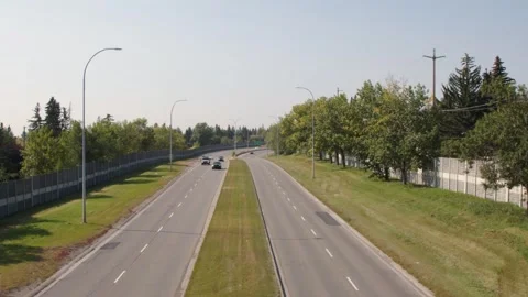 Vehicle traffic time-lapse on John Laurie Blvd, green city corridor Stock Footage 317145206
