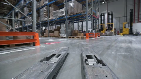 Vehicle trucks move at large rows between shelf with cardboard boxes, products, Stock Footage 199490362