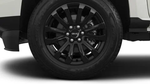 Vehicle wheel close up side view Summit White 2021 GMC Canyon Elevation Standard Stock Footage 159592919