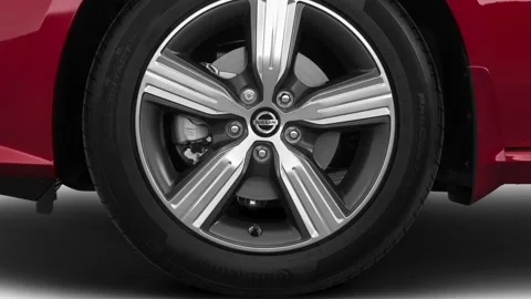 Vehicle wheel close up side view Scarlet Ember 2021 Nissan Altima 2.5 SV Stock Footage 159593401