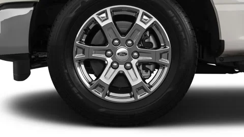 Vehicle wheel close up side view in studio Oxford White 2021 Ford F-150 XLT Stock Footage 159593562