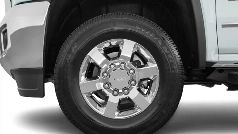 Vehicle wheel close up side view Summit White 2016 GMC Sierra 2500HD SLT Stock Footage 159863309