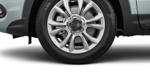 Vehicle wheel close up side view in studio Grigio Argento 2016 Fiat 500X lounge Stock Footage 159865339
