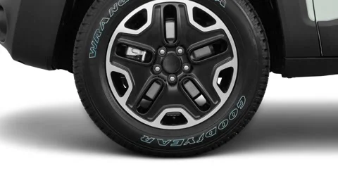 Vehicle wheel close up side view Alpine White 2016 Jeep Renegade Trailhawk Stock Footage 159870040