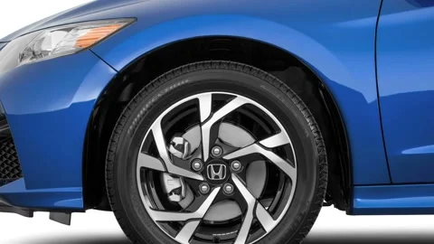 Vehicle wheel close up side view Aegean Blue Metallic 2016 Honda CR-Z LX Stock Footage 159874103