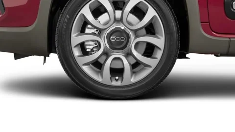 Vehicle wheel close up side view in studio Rosso 2016 Fiat 500L Trekking Stock Footage 159880712