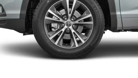 Vehicle wheel close up side view Blizzard Pearl 2016 Toyota Highlander XLE Stock Footage 159881618