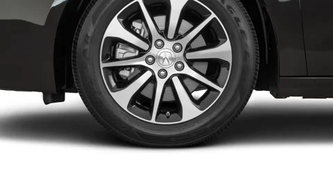 Vehicle wheel close up side view in studio Crystal Black Pearl 2017 Acura TLX Stock Footage 159906765