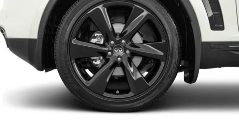 Vehicle wheel close up side view in studio Majestic White 2017 Infiniti QX70 Video stock 159922515