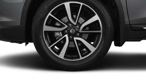 Vehicle wheel close up side view in studio Gun Metallic 2018 Nissan Rogue SL Stock Footage 160007904