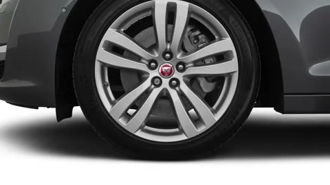 Vehicle wheel close up side view Corris Gray Metallic 2018 Jaguar XJL Portfolio Stock Footage 160008359