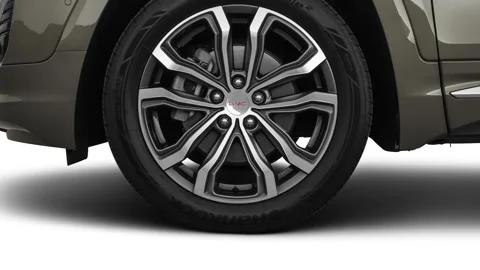 Vehicle wheel close up side view Mineral Metallic 2018 GMC Terrain Denali Stock Footage 160016289