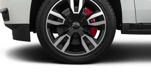 Vehicle wheel close up side view Summit White 2019 Chevrolet Suburban Premier Stock Footage 160024342