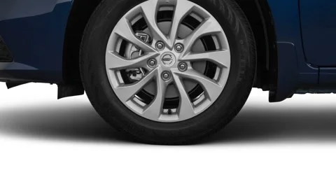 Vehicle wheel close up side view Deep Blue Pearl Metallic 2019 Nissan Sentra SV Stock Footage 160026232