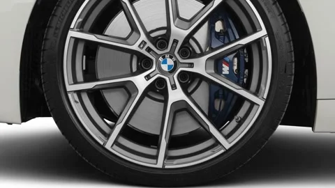Vehicle wheel close up side view Alpine White 2019 BMW 8-series M850i xDrive Stock Footage 160062920
