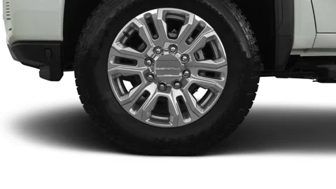 Vehicle wheel close up side view Summit White 2020 GMC Sierra 3500HD Denali Stock Footage 160091624