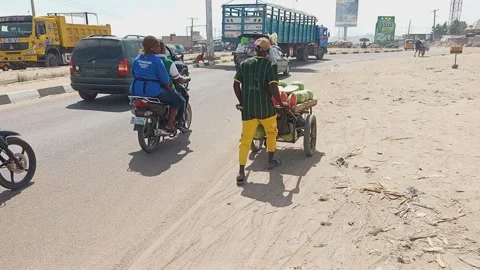 Vehicles Approaching Traffic Calming Chicane Eastern Bypass Kano Nigeria 動画素材 321806570