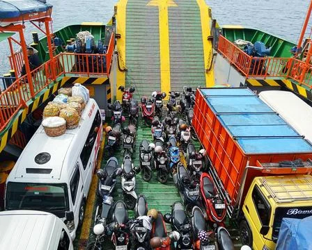 Vehicles being transported inside the ferry boat on the crossing Fotos de archivo