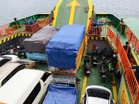 Vehicles being transported inside the ferry boat on the crossing Fotos de archivo