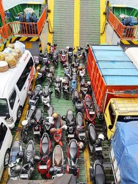Vehicles being transported inside the ferry boat on the crossing Fotos de archivo