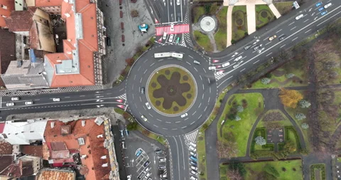 Vehicles on a busy roundabout junction. Traffic circle with a lot of car Brasov Video stock 198218980