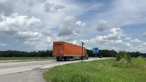 Vehicles drive past a Flock Camera on an Indiana Highway Video stock 344455830