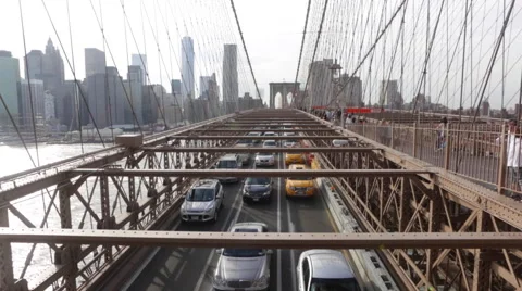 Vehicles drive through the Brooklyn Bridge in New York Stock Footage 50521405
