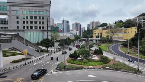 Vehicles drive through a multi-lane urban intersection. Stock Footage 333661607
