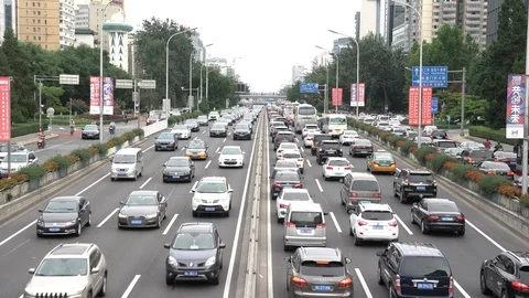 Vehicles driving on Beijing's Second Ring Road during evening rush hour Stock Footage 93699422