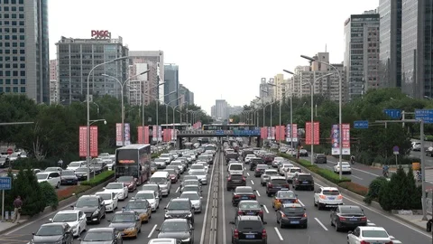 Vehicles driving on Beijing's Second Ring Road during evening rush hour Stock Footage 93700536