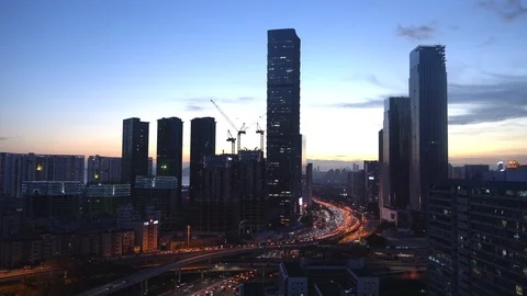 Vehicles driving on a main road during the evening rush hour in Shenzhen Stock Footage 95545976