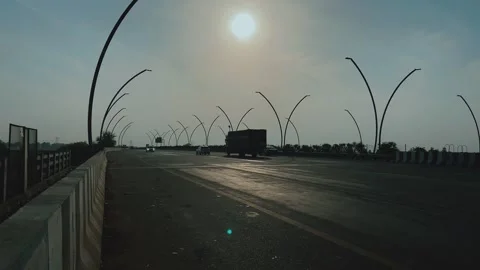 Vehicles Driving on a Modern Bridge at Sunset Stock Footage 341631703