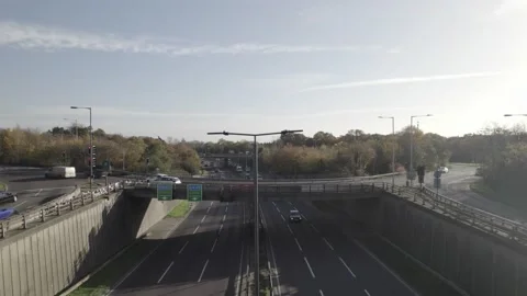 Vehicles driving on multilane highway surrounded by trees Video stock 167959930