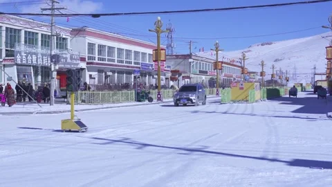 Vehicles driving in a poor town in winter Stock-Footage 243035497