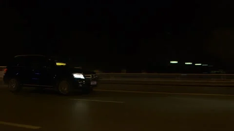 The vehicles driving on the road at night Stock Footage 261641981