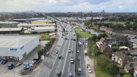 Vehicles driving on trunk road heading from downtown Stock Footage 164723950