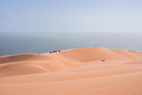 Vehicles on a dune crest Stock Photos