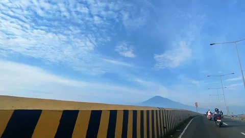 Vehicles on Elevated Flyover with Mountain View in Cirebon Stock Footage 346404752