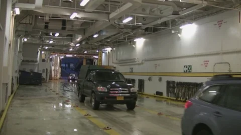 Vehicles enter Alaskan ferry Stock Footage 79418621