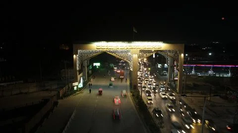 Vehicles exiting Bab-e-Lahore (Door of Lahore City) Stock Photos