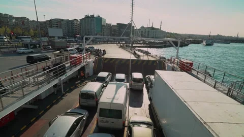 Vehicles getting off the car ferry Stock Footage 146788961