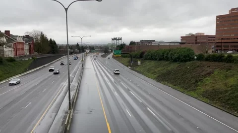 Vehicles on the I-5 Freeway in Vancouver, WA USA going to Portland, Oregon Stock Footage 280101097