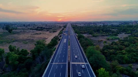 Vehicles increasing on highway during sunset Stock Footage 283311052