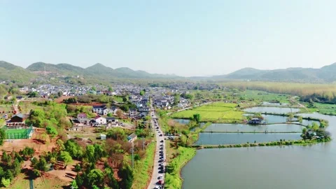 Vehicles line up into the countryside Stock Footage 233330713